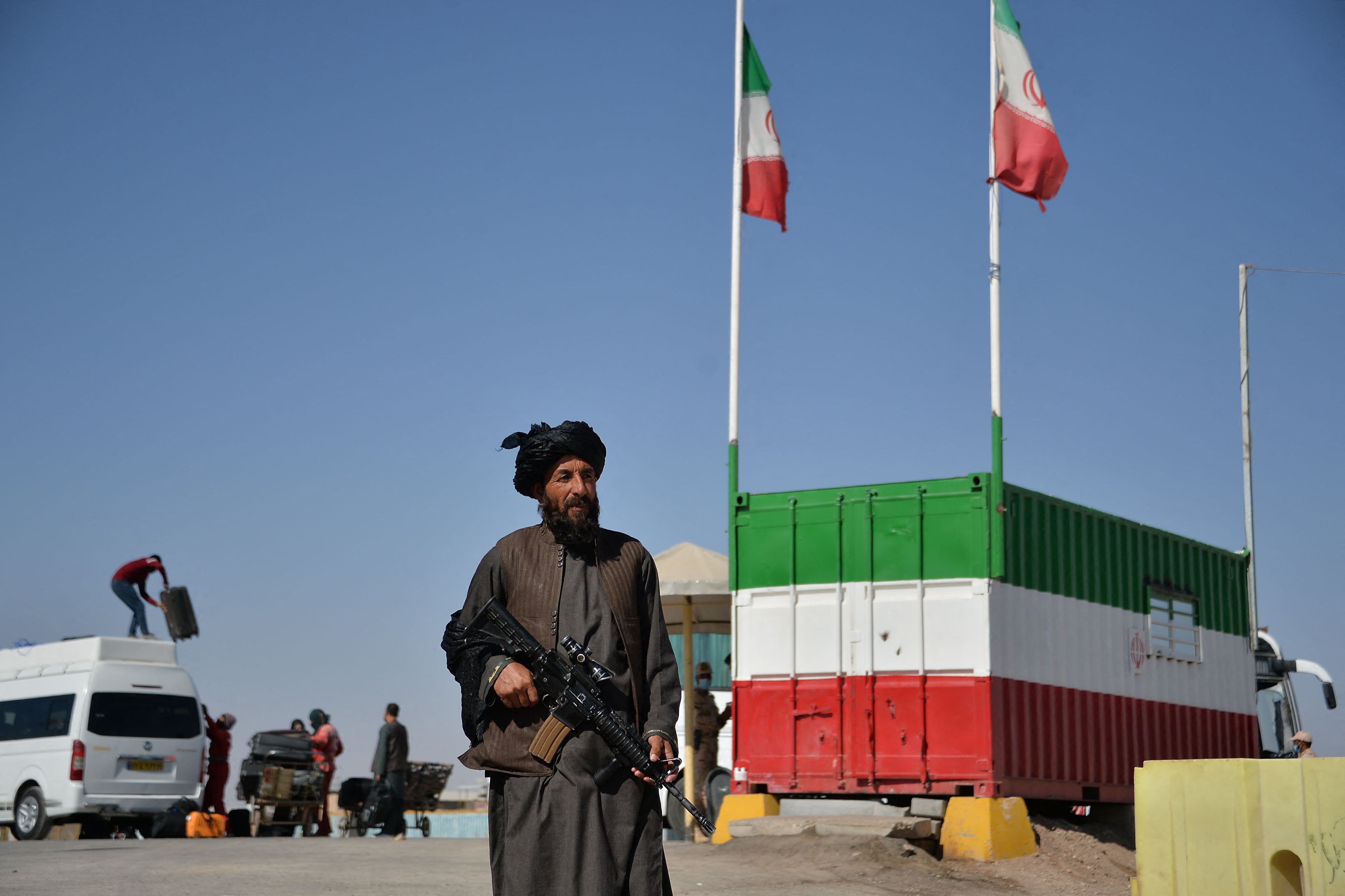 In this picture taken on October 19, 2021 a Taliban fighter stands guard at the Islam Qala border between Iran and Afghanistan. (AFP)