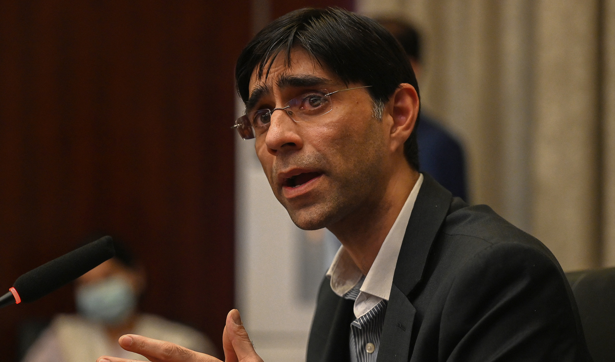 Pakistan's national security advisor Moeed Yusuf gestures as he speaks to members of the media in Islamabad on September 15, 2021 about the ongoing situation in Afghanistan. (AFP/File)