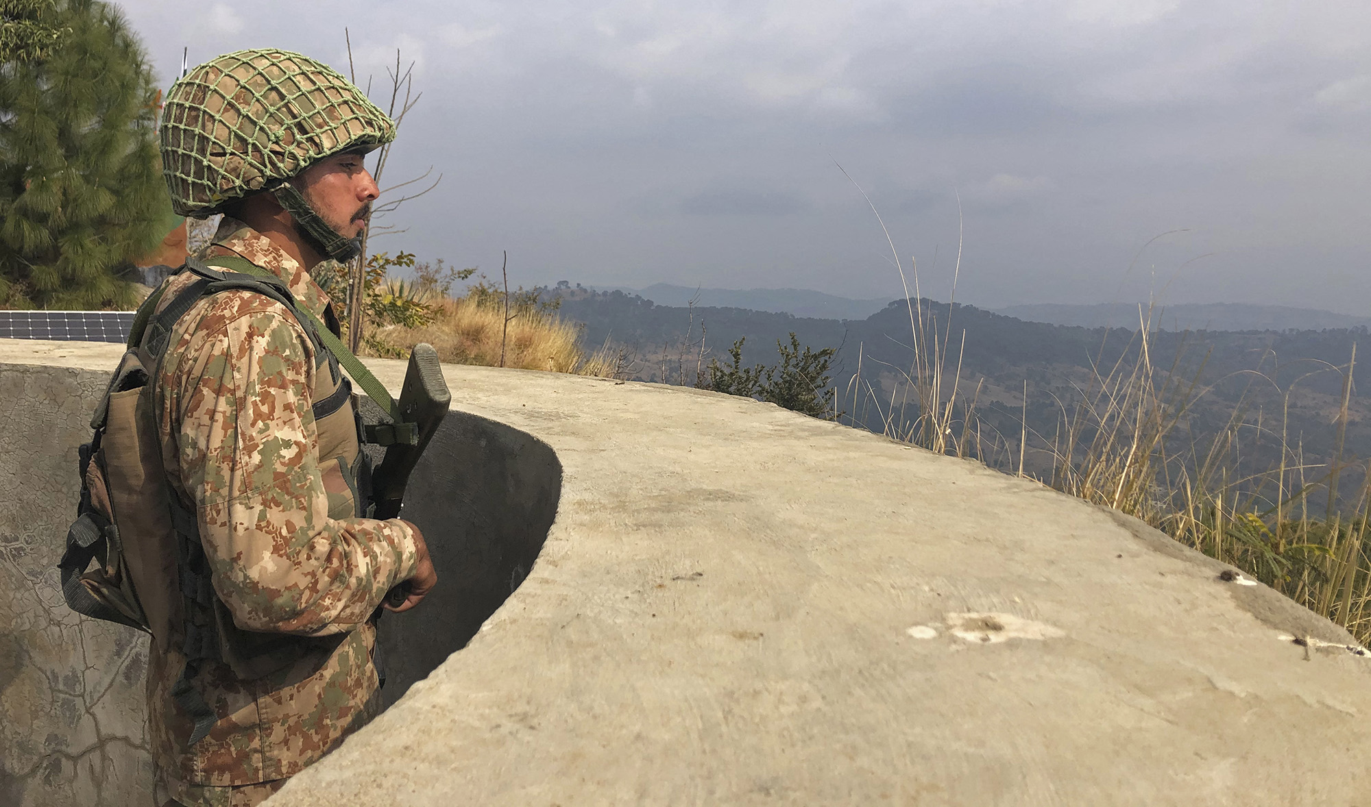 A Pakistan's army soldier stands guard on the Line of Control (LoC) at Abdullah Pur village in Bhimber district of Pakistani-administered Kashmir on February 5, 2021. (AFP/File)