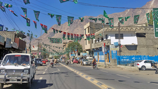 A vehicle drives past campaign flags of different political parties ahead of the legislative assembly elections in the city of Gilgit, Gilgit Baltistan on Nov. 9, 2020. (REUTERS)