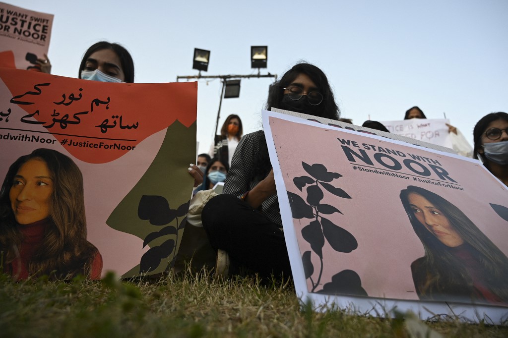 Women rights activists hold placards during a protest rally against the brutal killing of Noor Mukadam, the daughter of a former Pakistani diplomat who was found murdered at a house in Pakistan's capital on July 20, in Islamabad on September 22, 2021. (AFP/File)