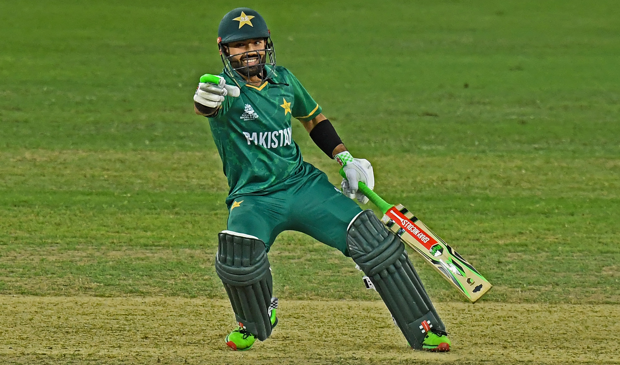 Pakistan's Mohammad Rizwan reacts as he takes a run during the ICC men’s Twenty20 World Cup semi-final match against Australia at the Dubai International Cricket Stadium, UAE, on November 11, 2021. (AFP)