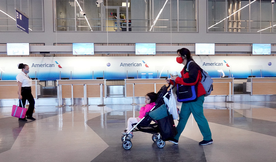 Passengers arrive for American Airlines flights at O'Hare International Airport on February 05, 2021 in Chicago, Illinois. (AFP)