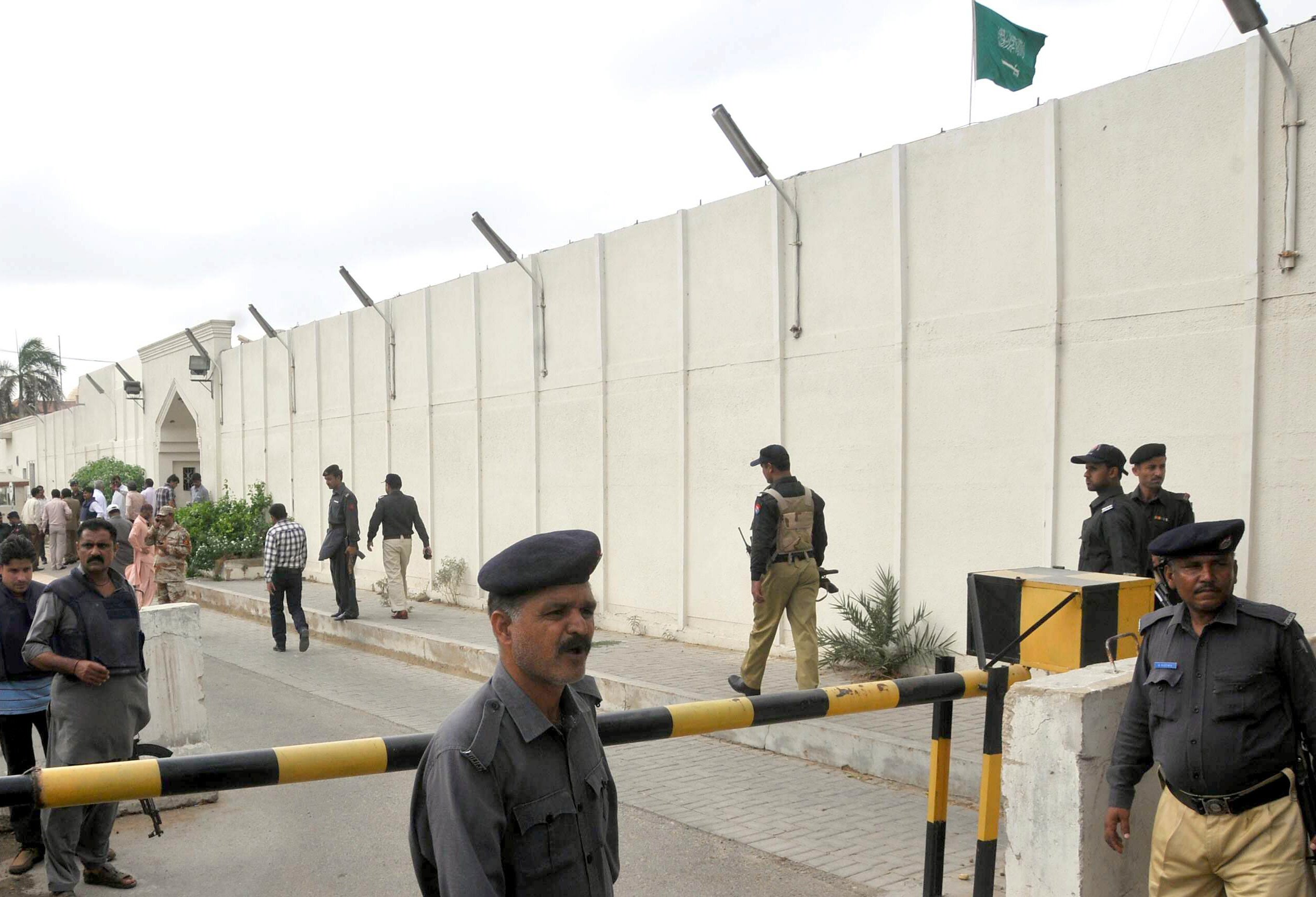 Policemen walk outside the Saudi consulate after unidentified attackers threw two hand grenades at the diplomatic facility in Karachi, Pakistan, on May 11, 2011. (Social Media/ FILE)