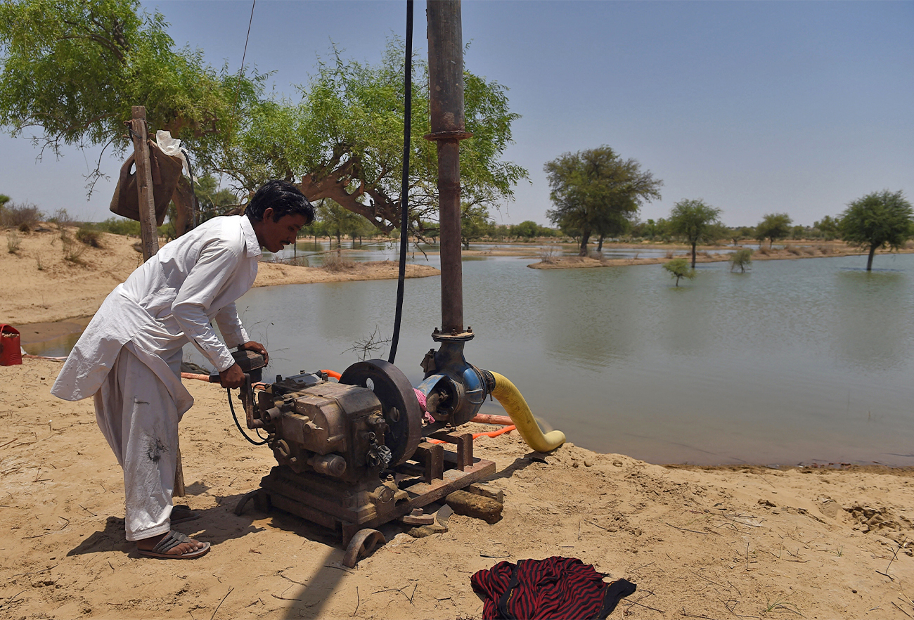 This picture taken on May 24, 2018 shows a Pakistani worker starting a water drawing pump at a site to store water in Islamkot, in the Tharparkar district of Pakistan's southern Sindh province. (AFP/File)