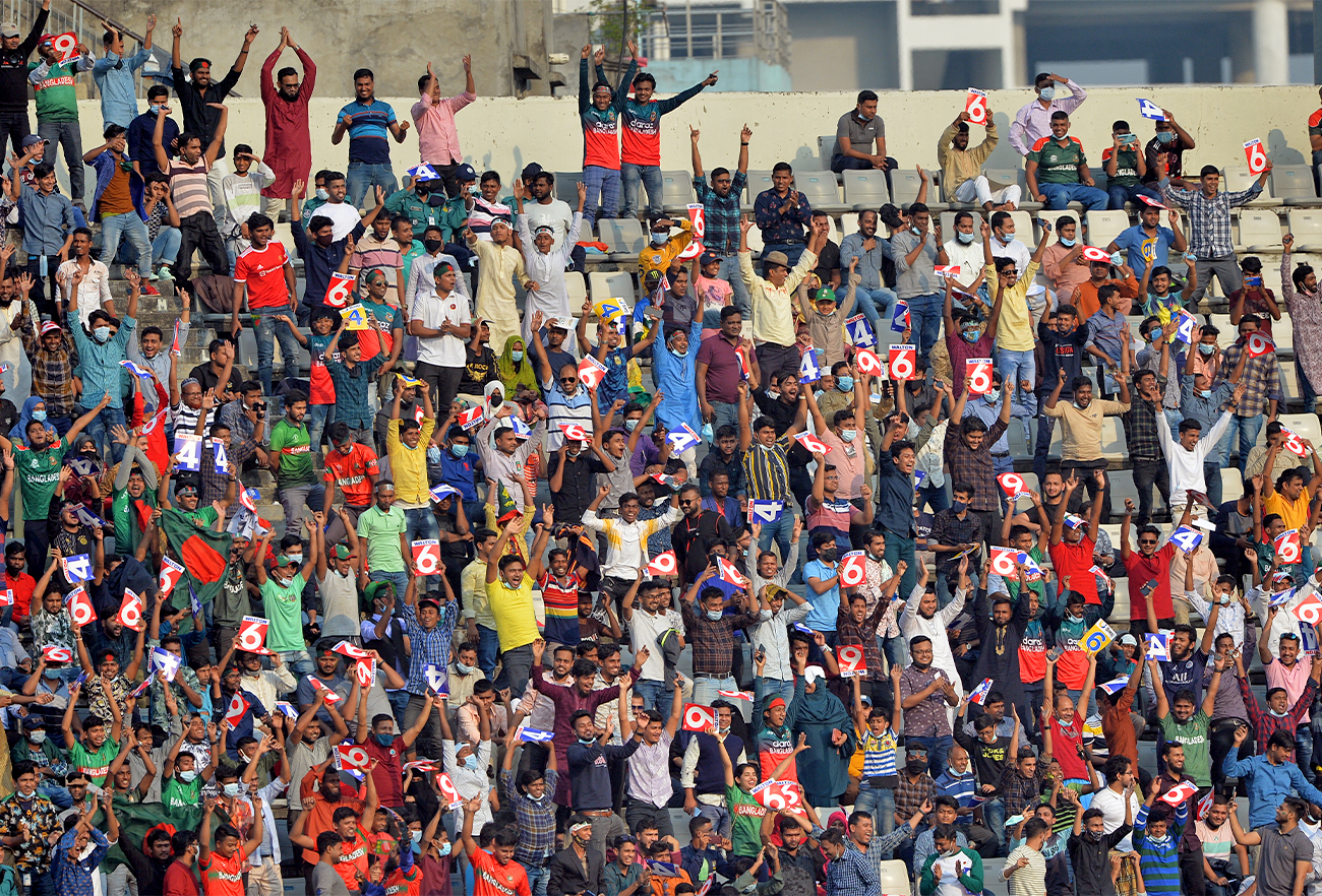 Spectators watch the T20 international cricket match between Bangladesh and Pakistan at the Sher-e-Bangla National Cricket Stadium in Dhaka on November 19, 2021. (AFP)