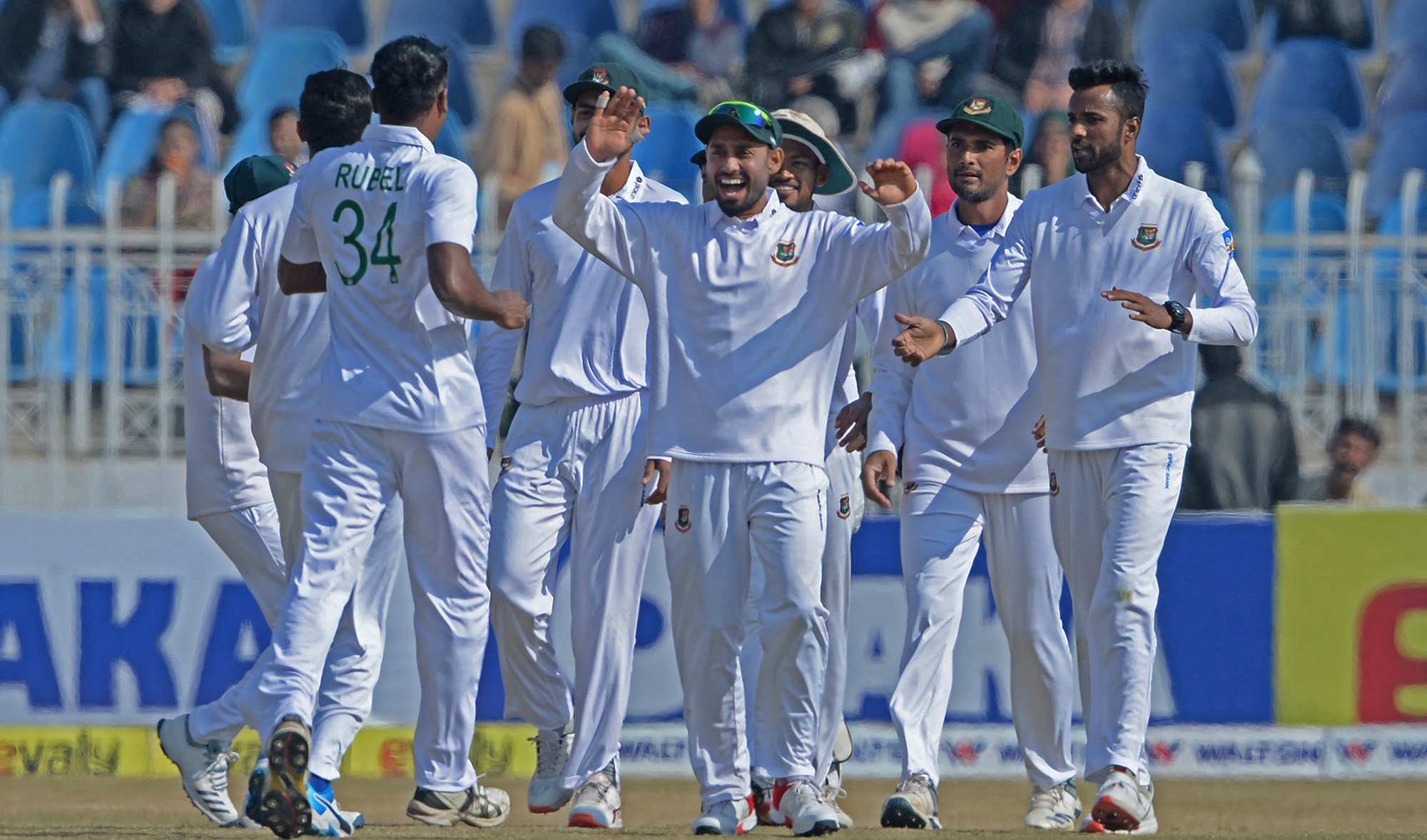 Bangladesh's cricketers celebrate the dismissal of Pakistan's Moammad Rizwan during the third day of the first cricket Test match against Pakistan in Rawalpindi on February 9, 2020. (AFP/File)