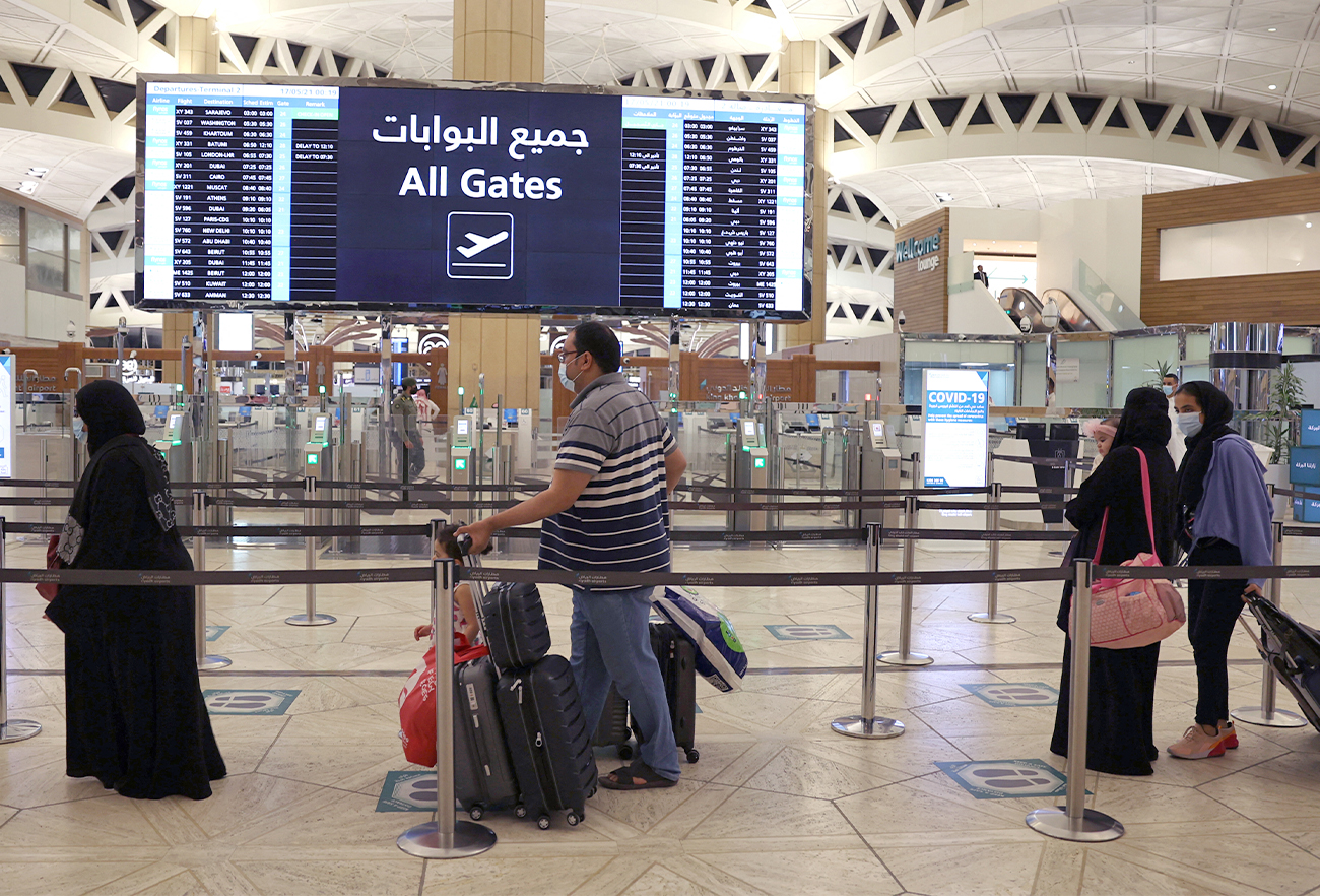 Saudi passengers arrive to King Khaled International airport in the capital Riyadh, Saudi Arabia, on May 17, 2021. (AFP/File)