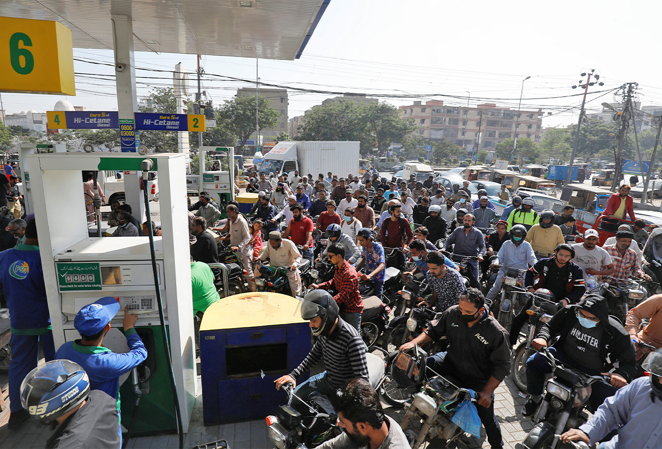 People on motorcycles wait for their turn to get petrol at a petrol station, after Pakistan Petroleum Dealers Association (PPDA) announced a countrywide strike, in Karachi, Pakistan, on November 25, 2021. (REUTERS)