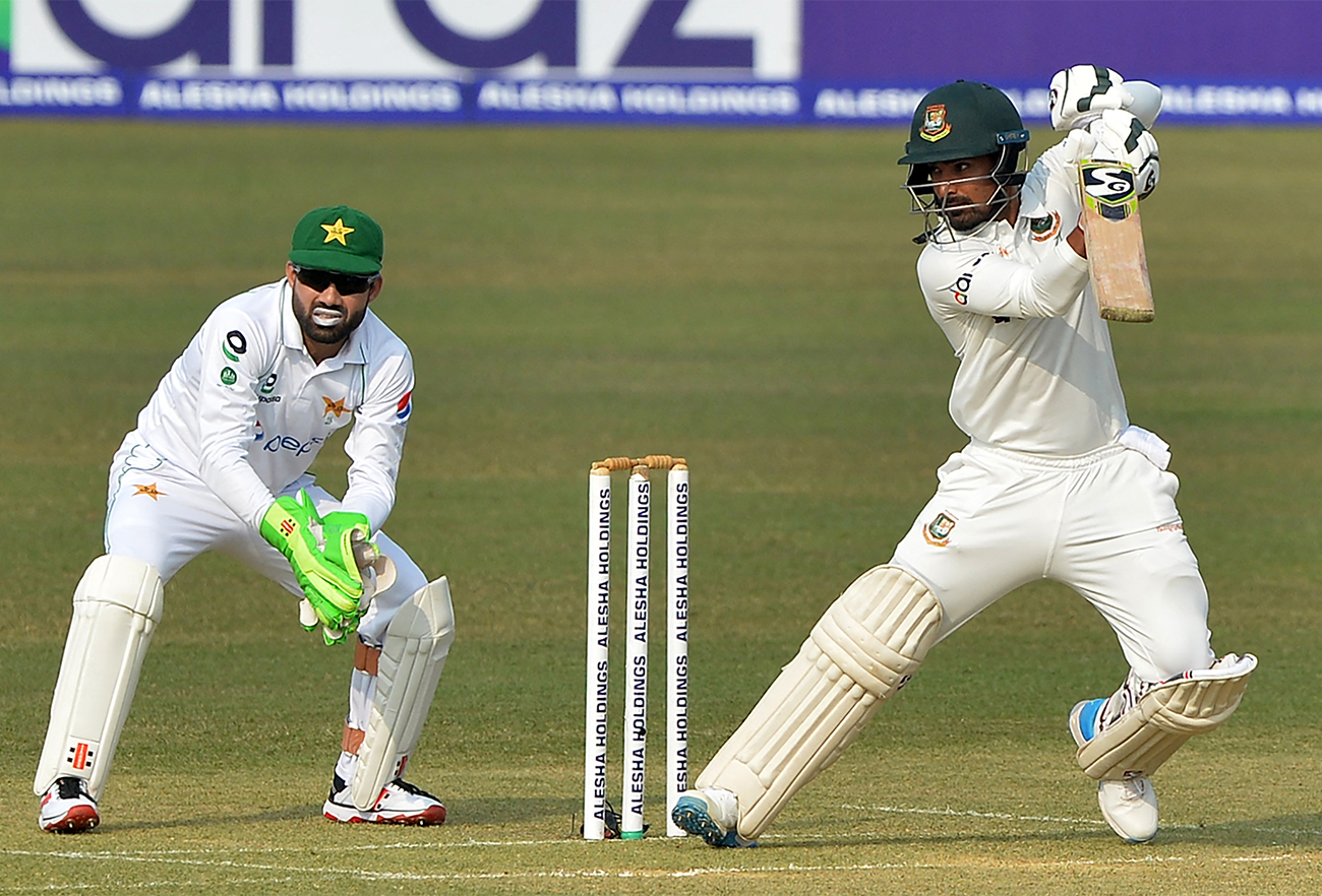 Bangladesh's Liton Das (R) plays a shot as Pakistan's wicketkeeper Mohammad Rizwan watches during the first day of the first Test cricket match between Bangladesh and Pakistan at the Zahur Ahmed Chowdhury Stadium in Chittagong on November 26, 2021. (AFP)