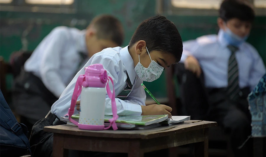 Students attend their class at a school in Rawalpindi on June 7, 2021. (AFP)