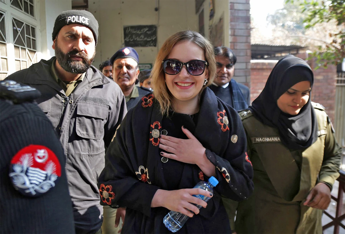 Pakistani police officers escort Tereza Hluskova, a Czech citizen, to a court in Lahore, Pakistan, on January 8, 2019. (AP/File)