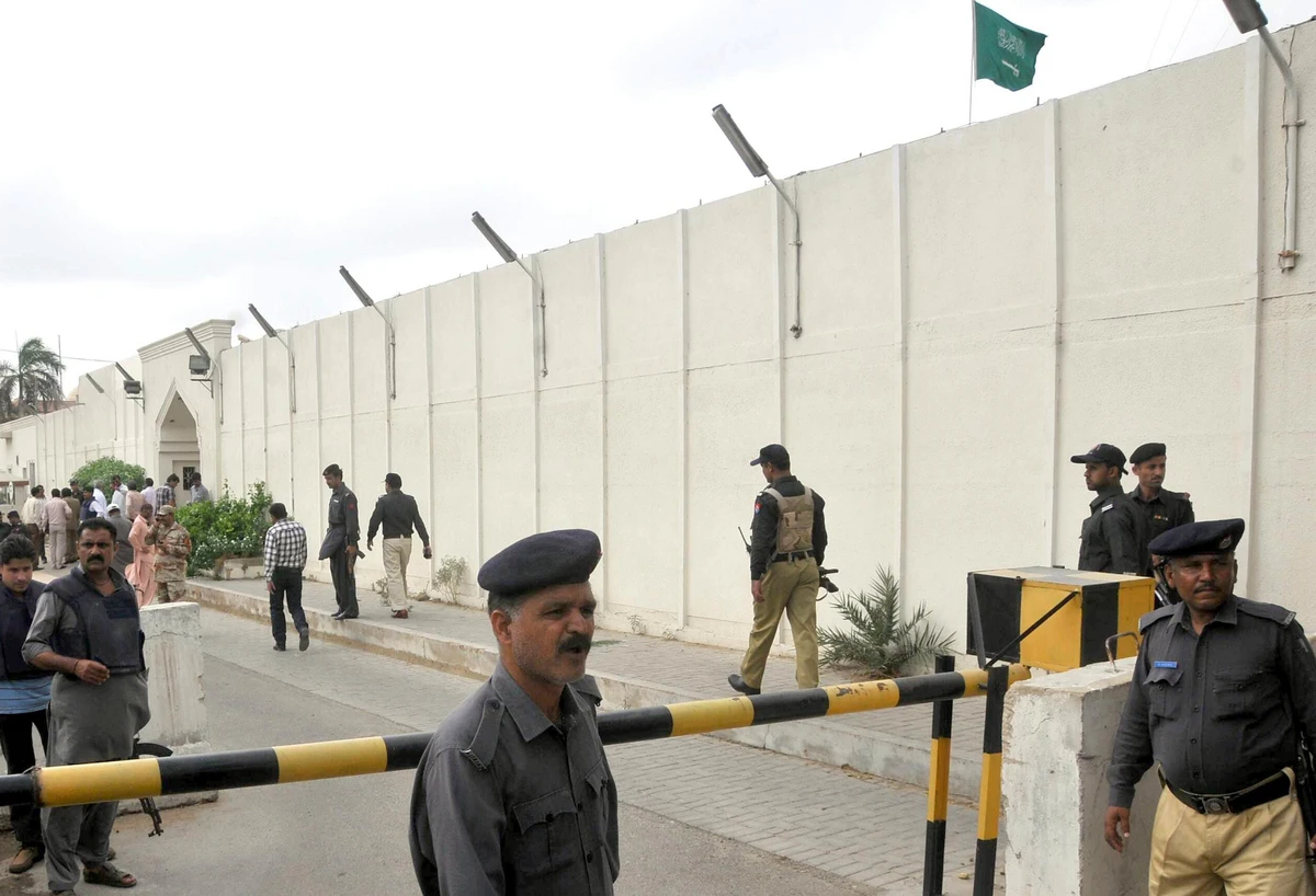 Policemen walk outside the Saudi consulate after unidentified attackers threw two hand grenades at the diplomatic facility in Karachi, Pakistan, on May 11, 2011. (Social Media/ FILE)
