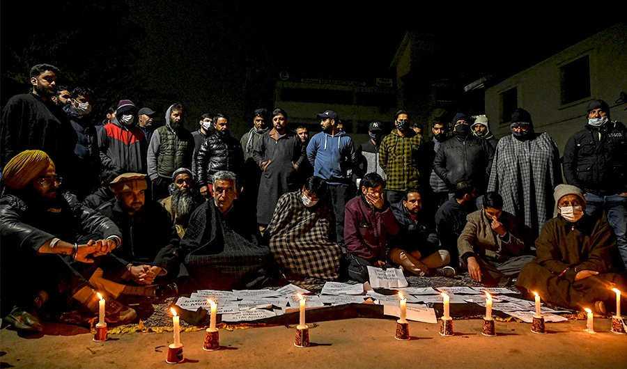 Family members of two Kashmiri civilians who died during an operation by Indian security forces demand justice and the bodies of their loved ones during a demonstration in Srinagar on November 17, 2021. (AFP)