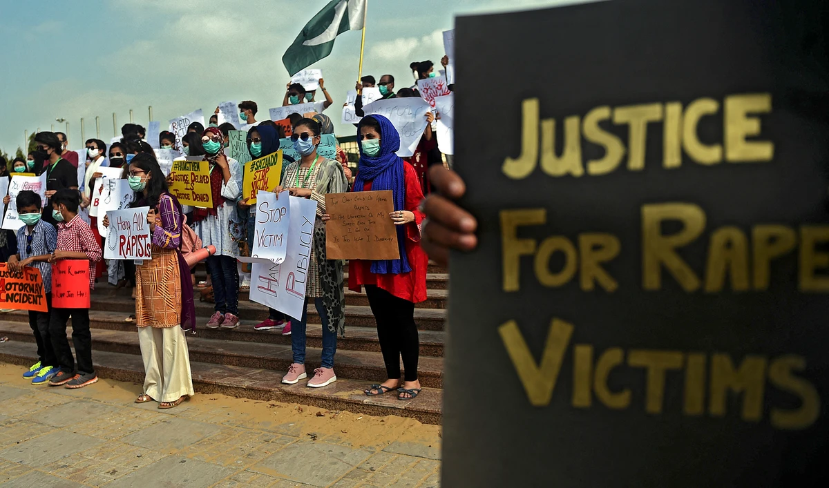 Members of VCare Welfare Trust hold placards during a protest against an alleged gang rape of a woman, in Karachi, Pakistan, on September 13, 2020. (AFP/File)