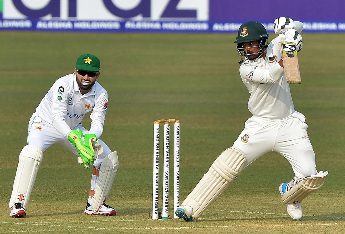 Bangladesh's Liton Das (R) plays a shot as Pakistan's wicketkeeper Mohammad Rizwan watches during the first day of the first Test cricket match between Bangladesh and Pakistan at the Zahur Ahmed Chowdhury Stadium in Chittagong on November 26, 2021. (AFP)