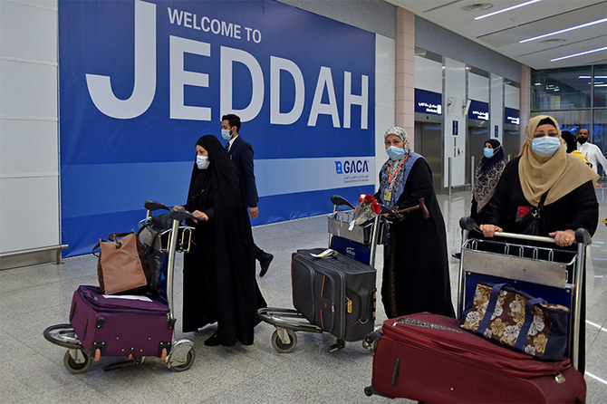 Pilgrims arrive at King Abdulaziz International Airport in the Red Sea coastal city of Jeddah on August 15, 2021. (AFP)