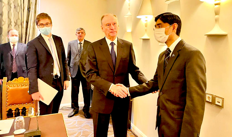 Pakistan’s National Security Adviser Moeed Yusuf (R) shakes hand with Nikolai Patrushev, the secretary of the security council of Russia (2nd from R) in during his visit to Russia in Moscow on Dec 1, 2021. (NSA office)