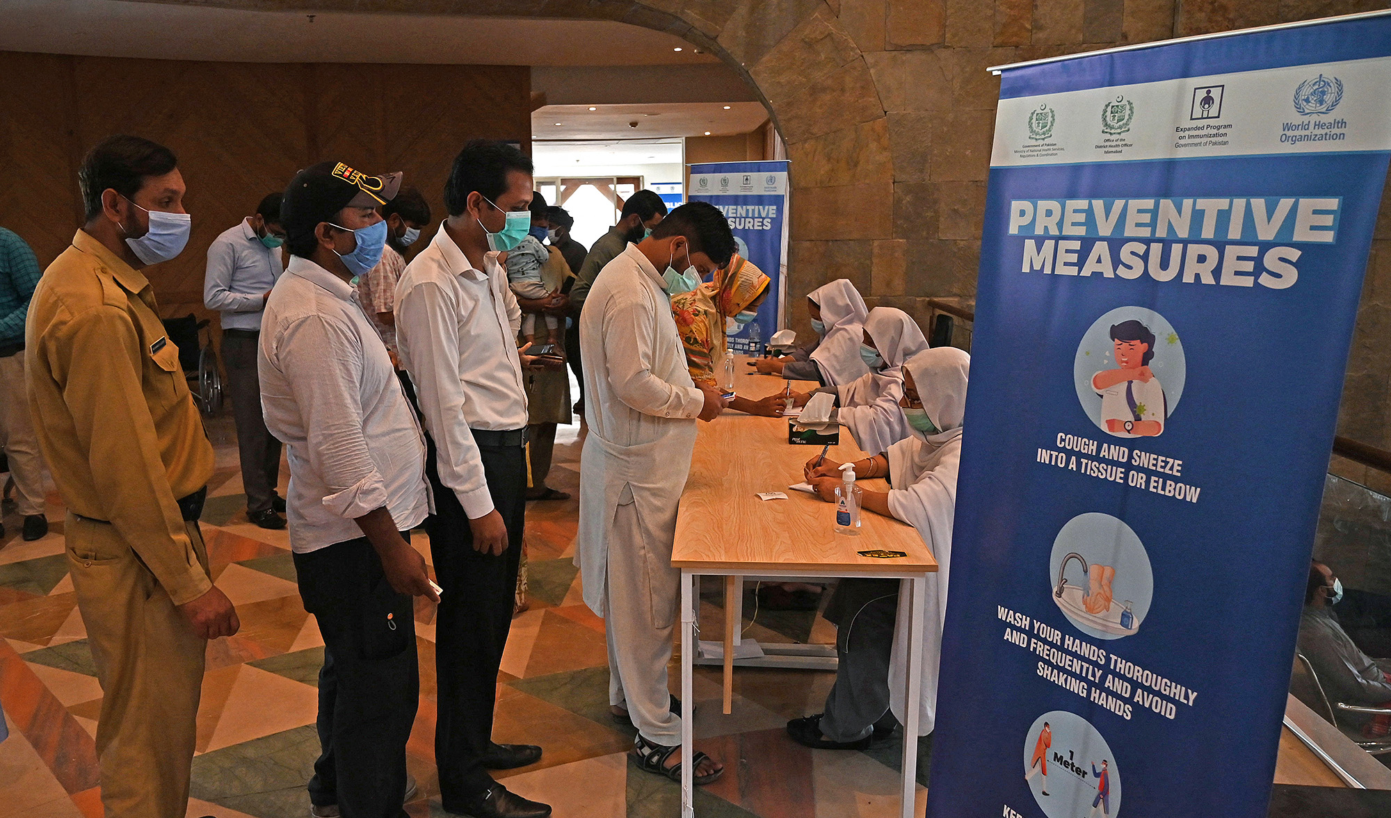 People register to get a dose of the Covid-19 coronavirus Sinovac vaccine at a mass vaccination centre in Islamabad, Pakistan, on June 3, 2021. (AFP/File)