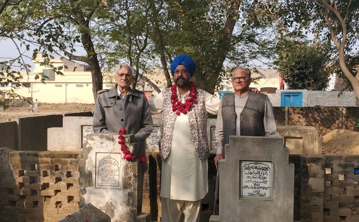 Dr. Tarunjit Singh Butalia, an American Sikh of Indian descent, poses with Pakistani lawmaker Chaudhry Mehmood Bashir Virk (left), at the graves of Virk’s parents in Gujranwala, Pakistan, on November 28, 2021 (Photo Courtesy: Dr. Tarunjit Singh Butalia)