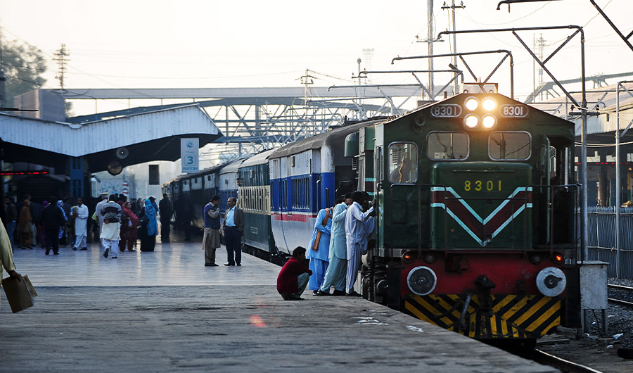 FILE - Pakistani passengers board a train at railway station in Rawalpindi on December 3, 2011. (AFP/ FILE)