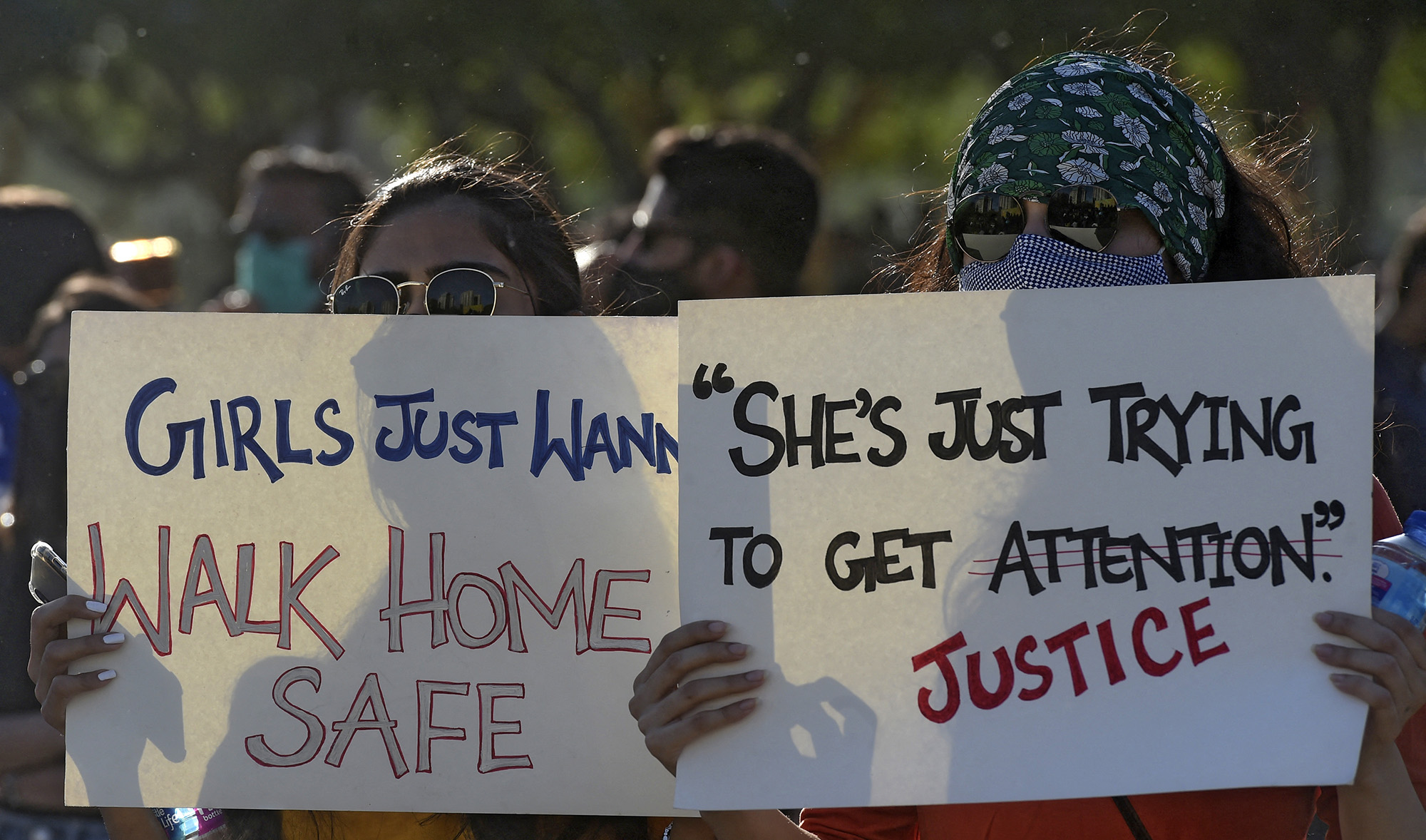 Activists of the Aurat March hold placards as they gather during a rally to mark International Women's Day in Karachi, Pakistan, on March 8, 2021. (AFP)