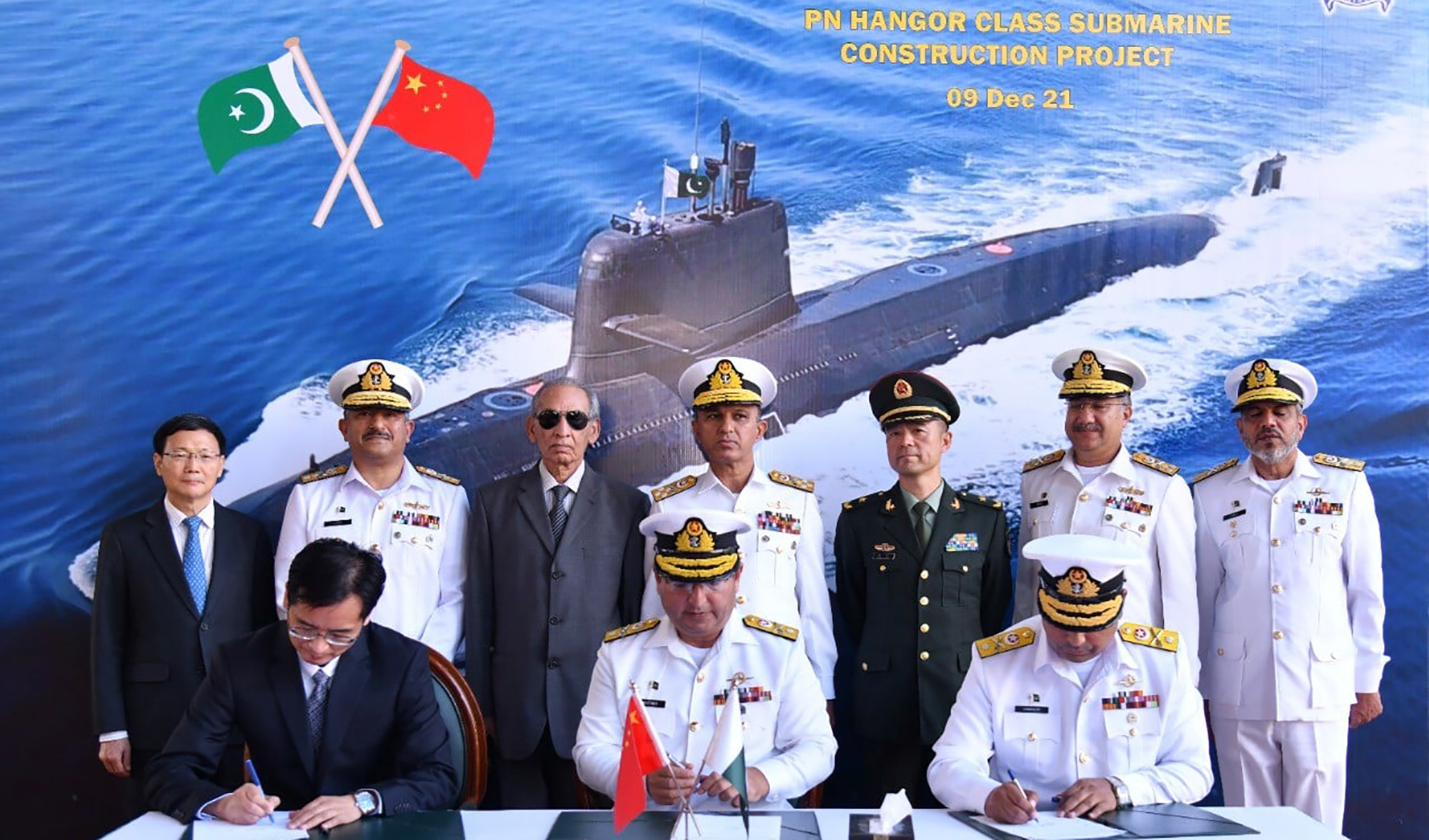 Pakistani and Chinese officials are seen together during a steel cutting ceremony to inaugurate a joint submarine building project in Karachi, Pakistan, on December 9, 2021. (Photo courtesy: Pakistan Navy)