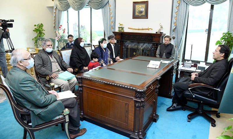 Prime Minister Imran Khan meets family members of missing journalist Mudassar Naaru in Islamabad, Pakistan, on December 9, 2021. (Photo courtesy: @ShireenMazari1/Twitter)