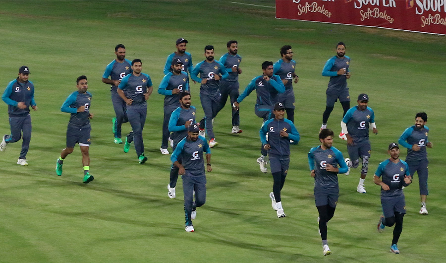 Players of Pakistan Cricket team warm up ahead of practice session at the National Stadium, in Karachi, Pakistan, Saturday, Dec. 11, 2021. (AP)