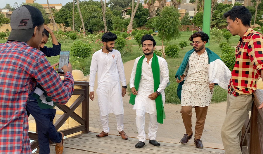 A group of Pakistani boys act for a TikTok video recording at a park in Karachi, Pakistan on August 11, 2020. (AN Photo)