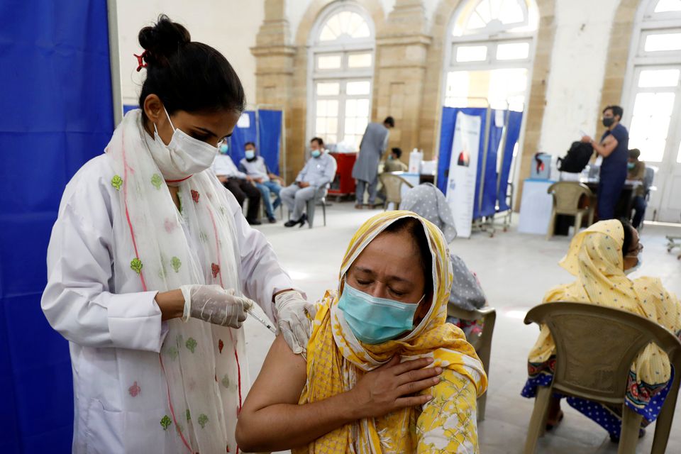 A resident receives a dose of coronavirus disease (COVID-19) vaccine, at a vaccination center in Karachi, Pakistan, on March 22, 2021. (REUTERS)