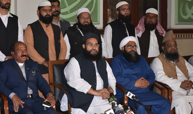 Hafiz Tahir Mahmood Ashrafi, Chairman Muttahida Ulema Board Punjab and special representative for PM on interfaith harmony (2nd from left sitting) talking to media in Lahore on Nov 28, 2021. (PID/FILE)