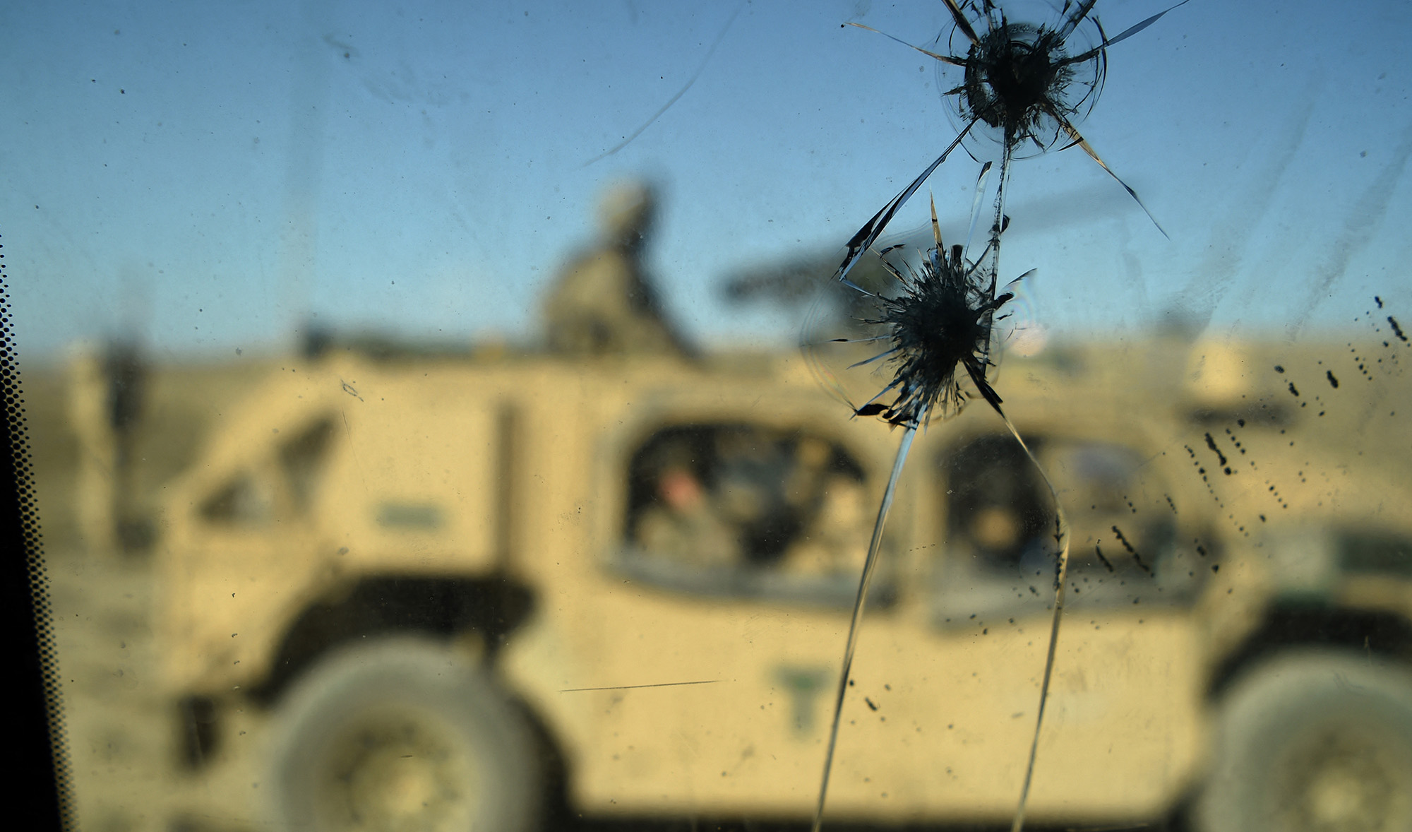 US Army soldiers are seen through a cracked window of an armed vehicle in a checkpoint during a patrol against Daesh militants in Deh Bala district in the eastern Afghan province of Nangarhar on July 7, 2018. (AFP/File)
