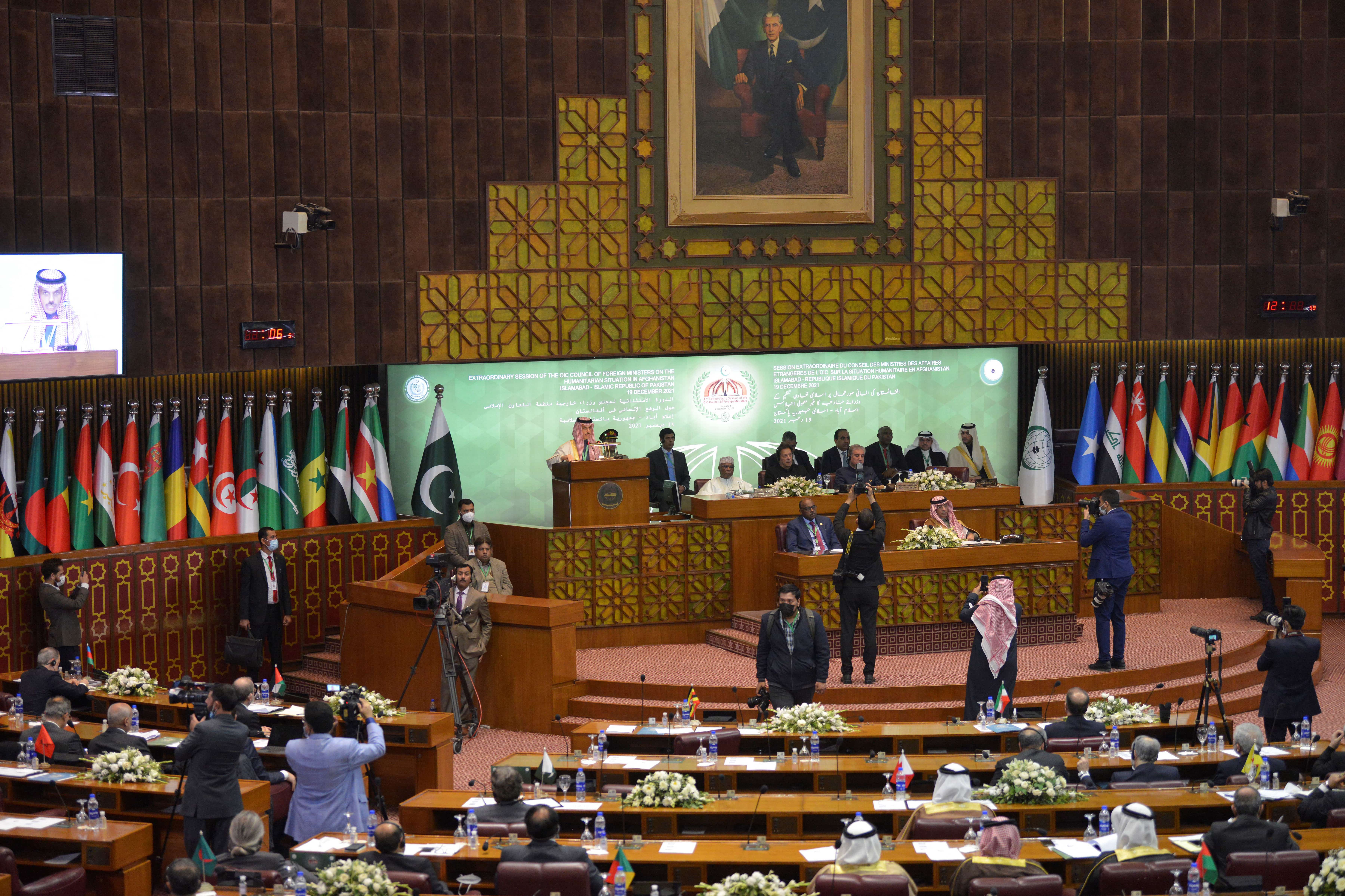 Saudi Arabia's Minister of Foreign Affairs Prince Faisal bin Farhan Al Saud (C) addresses the opening of a special meeting of the 57-member OIC in Islamabad on December 19, 2021. (AFP)