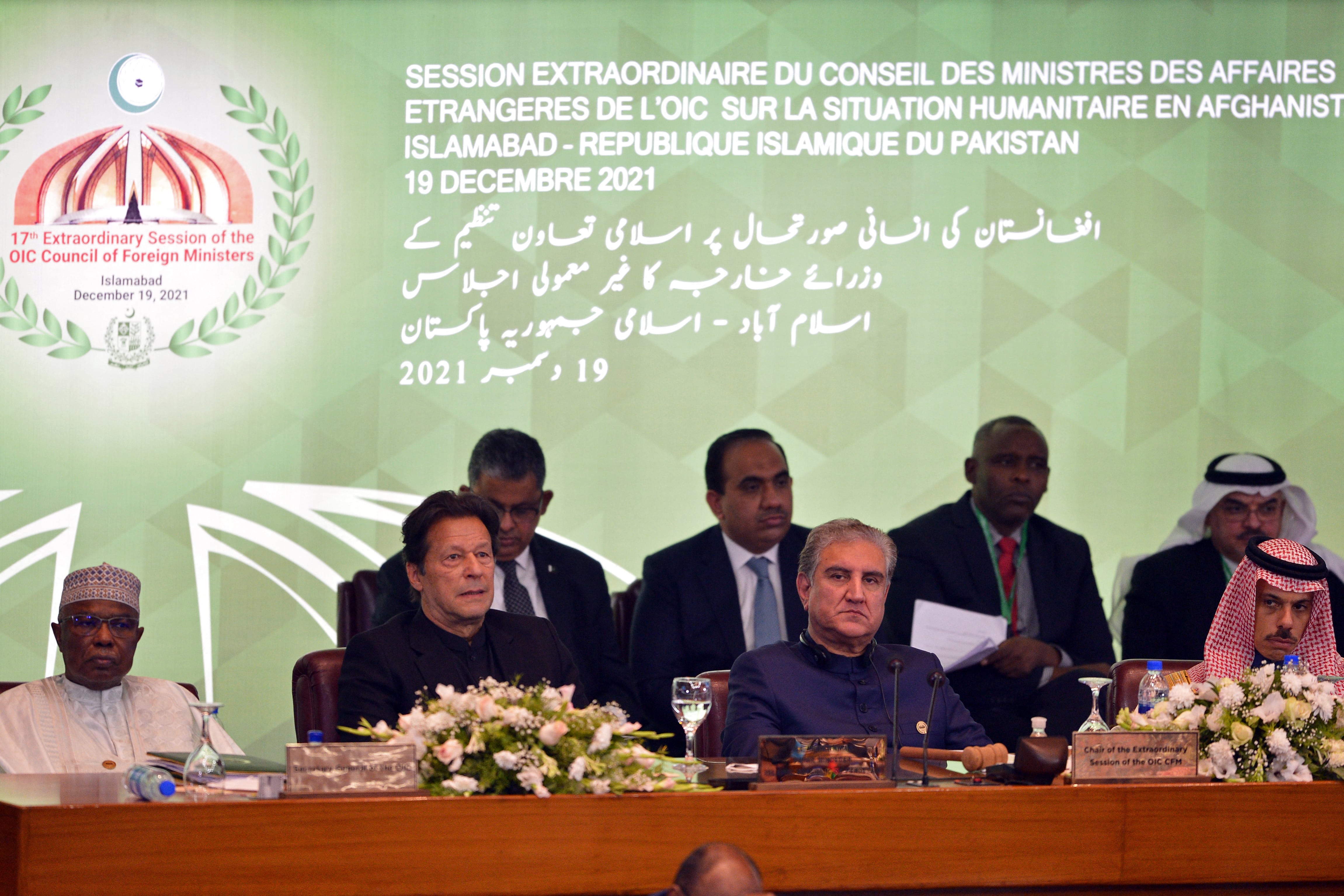(Front L-R) Secretary of Organisation of Islamic Cooperation (OIC) Hissein Brahim Taha, Pakistan's Prime Minister Imran Khan his Foreign Minister Shah Mahmood Qureshi and Saudi Arabia's Minister of Foreign Affairs Prince Faisal bin Farhan Al Saud attend the opening of a special meeting of the 57-member OIC in Islamabad on December 19, 2021. (AFP)