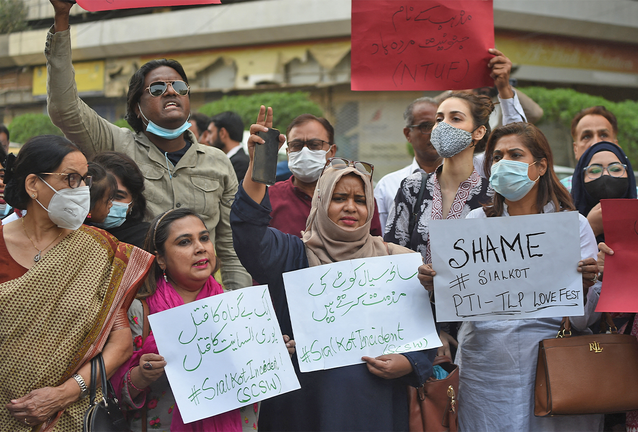 Members of Joint Action Committee carry placards during a protest in Karachi, Pakistan, on December 4, 2021 against the killing of a Sri Lankan factory manager in Sialkot. (AFP)