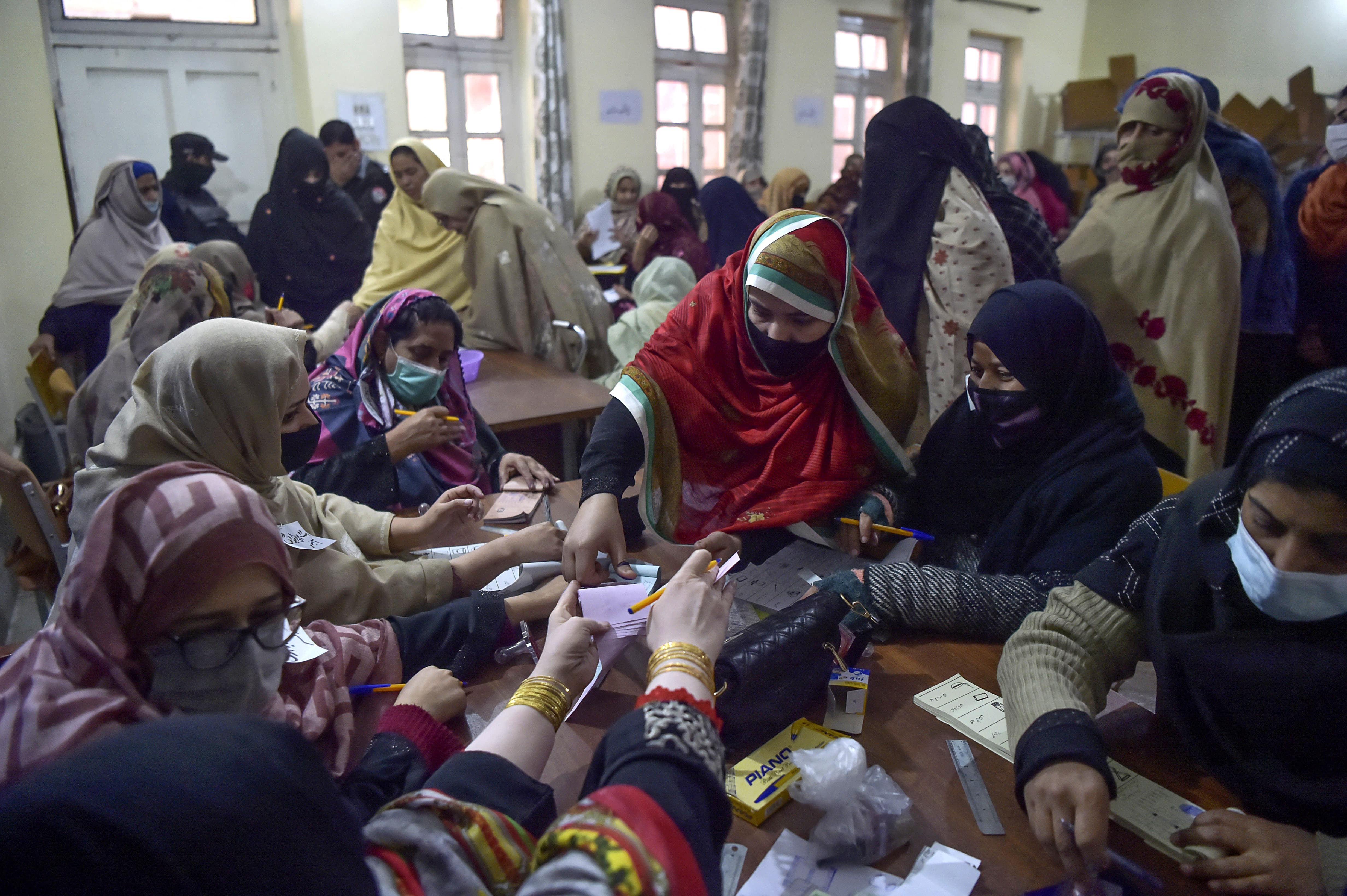 Women gather to cast their vote at a polling station during a local body election in Khyber Pakhtunkhwa province of Peshawar on December 19, 2020. (AFP/ File)