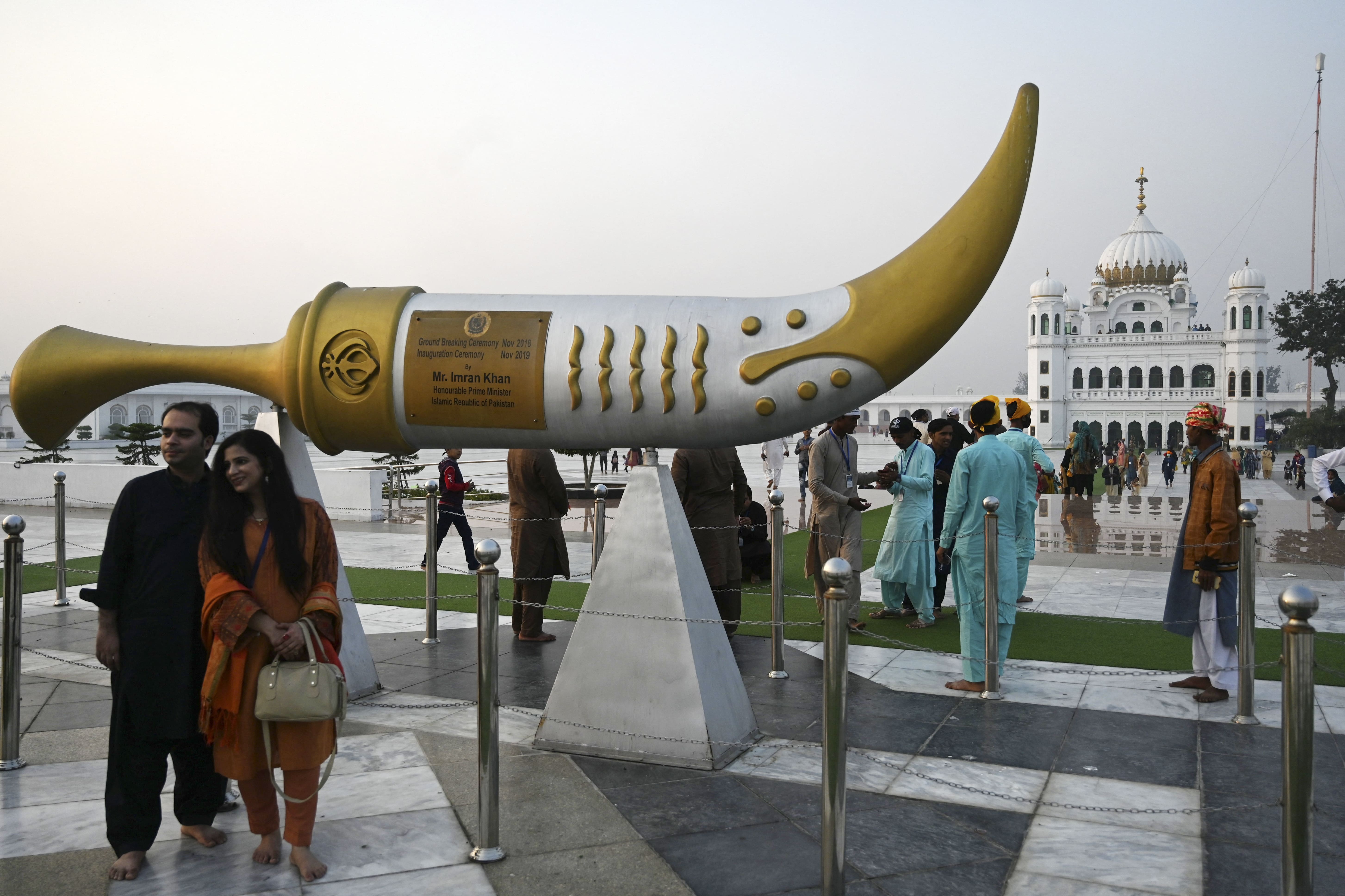 Sikh pilgrims arrive to take part in a religious ritual on the eve of the birth anniversary of Guru Nanak, the founder of Sikhism, at Gurdwara Darbar Sahib in Kartarpur near the India-Pakistan border in Narowal, Pakistan on November 18, 2021. (Photo courtesy: AFP)