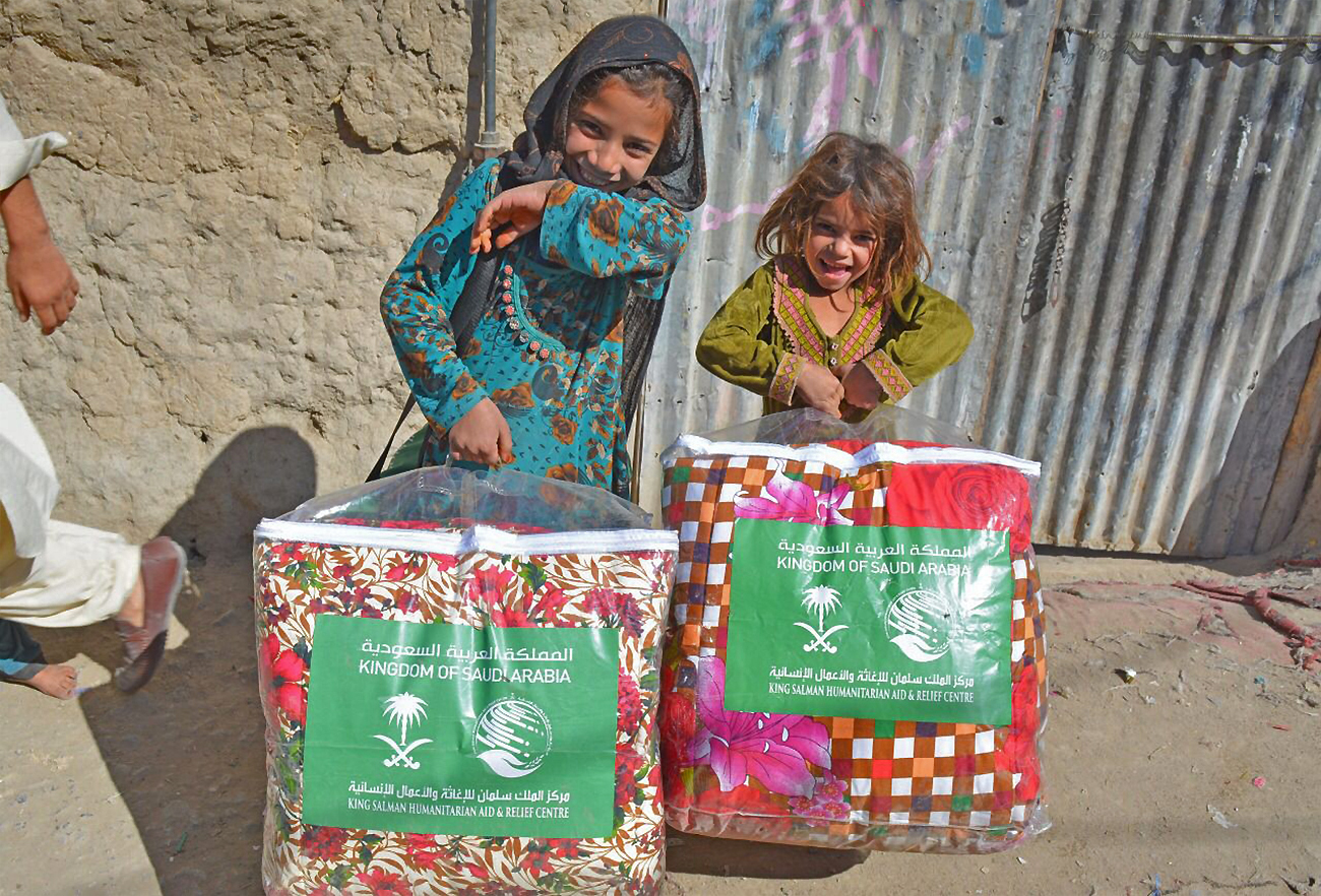 Children pose for a picture with winter kits as SaudiArabia’s King Salman Humanitarian Aid and Relief Center concludes winter aid distribution in Pakistan’s southern Balochistan and northwestern Khyber Pakhtukhwa on December 28, 2021. (KSRelief)