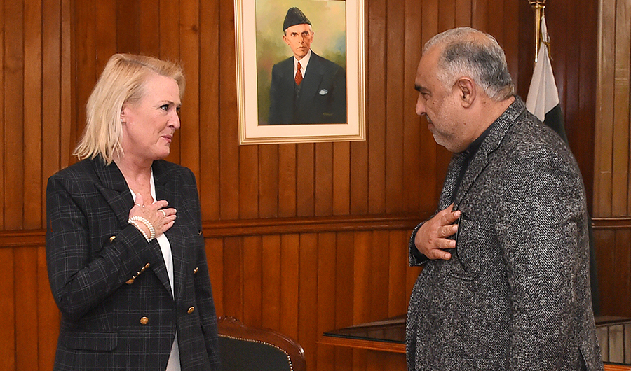 Pakistan National Assembly Speaker Asad Qaiser (R) greets Chargé d’affaires of US Angela Aggeler (L) at the parliament house in Islamabad on December 28, 2021. (PID)