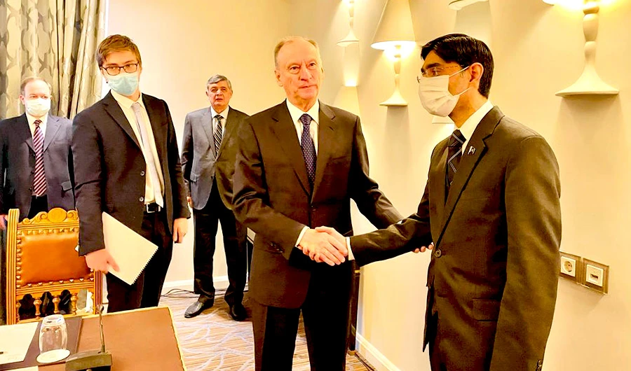 Pakistan’s National Security Adviser Moeed Yusuf (R) shakes hand with Nikolai Patrushev, the secretary of the security council of Russia (2nd from R) in during his visit to Russia in Moscow on Dec 1, 2021. (NSA office)