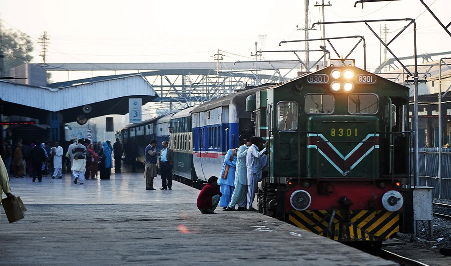 FILE - Pakistani passengers board a train at railway station in Rawalpindi on December 3, 2011. (AFP/ FILE)