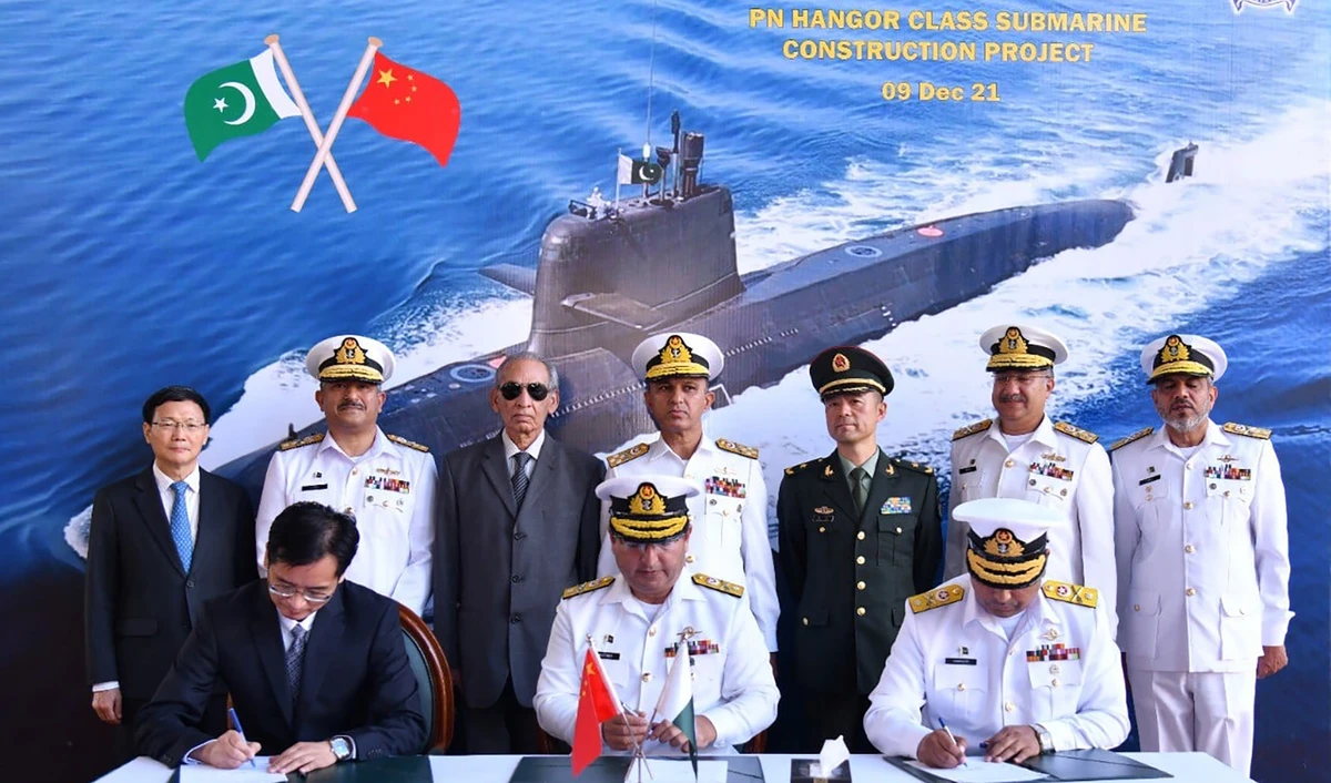Pakistani and Chinese officials are seen together during a steel cutting ceremony to inaugurate a joint submarine building project in Karachi, Pakistan, on December 9, 2021. (Photo courtesy: Pakistan Navy)
