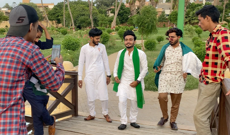 A group of Pakistani boys act for a TikTok video recording at a park in Karachi, Pakistan on August 11, 2020. (AN Photo)