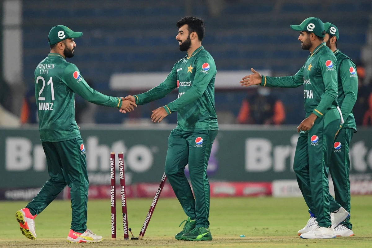 Pakistan's players celebrate their win at the end of the first Twenty20 international cricket match between Pakistan and West Indies at the National Stadium in Karachi on December 13, 2021. (AFP)