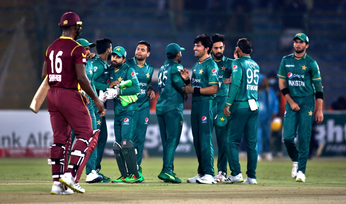 Pakistan's players congratulate each others after winning the second Twenty20 international cricket match against West Indies at the National Stadium, in Karachi, Pakistan on December 14, 2021. (AP)