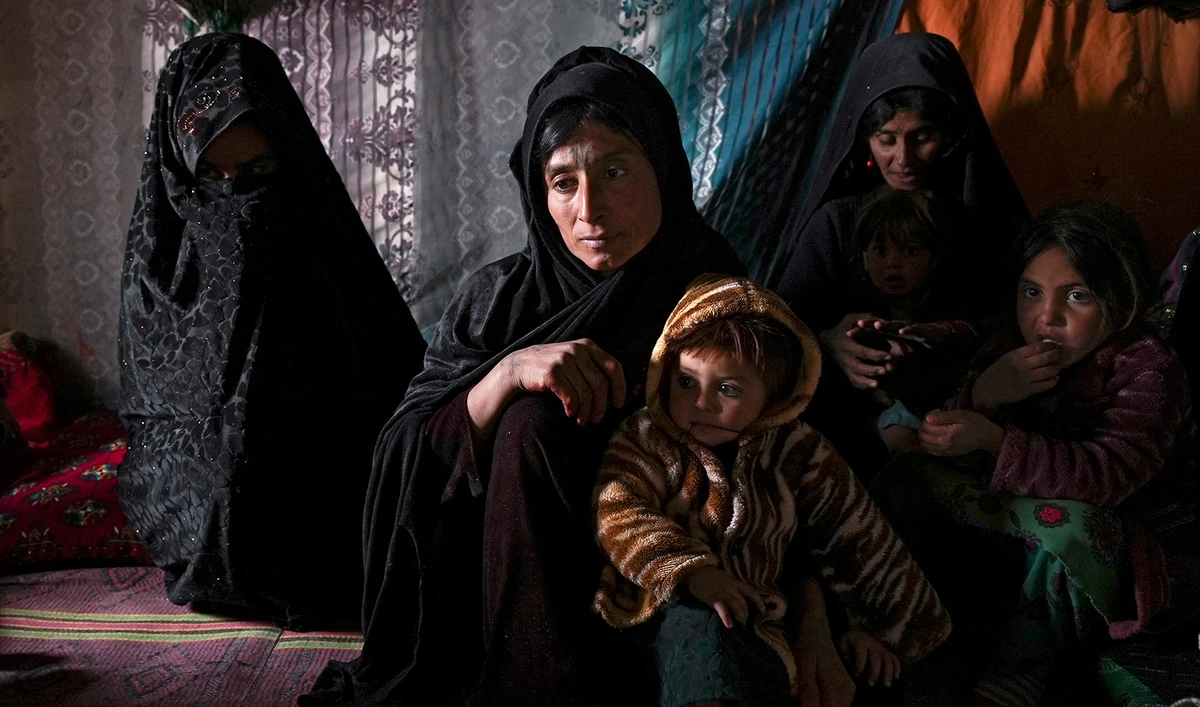 Guldasta and family members gather in their house at a settlement near Qala-e-Naw, Afghanistan, December 14, 2021. (AP/File)