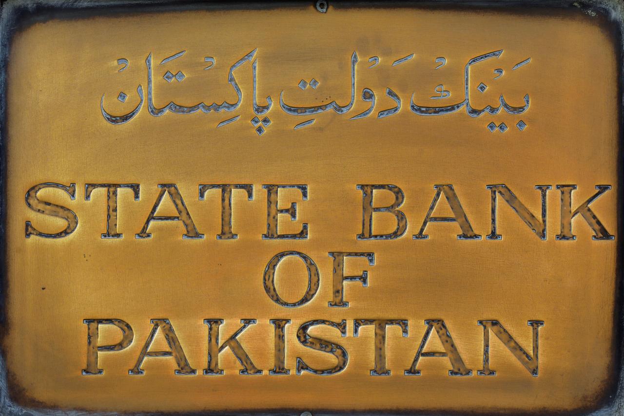 A brass plaque of the State Bank of Pakistan is seen outside of its wall in Karachi, Pakistan, on December 5, 2018. (REUTERS/File)