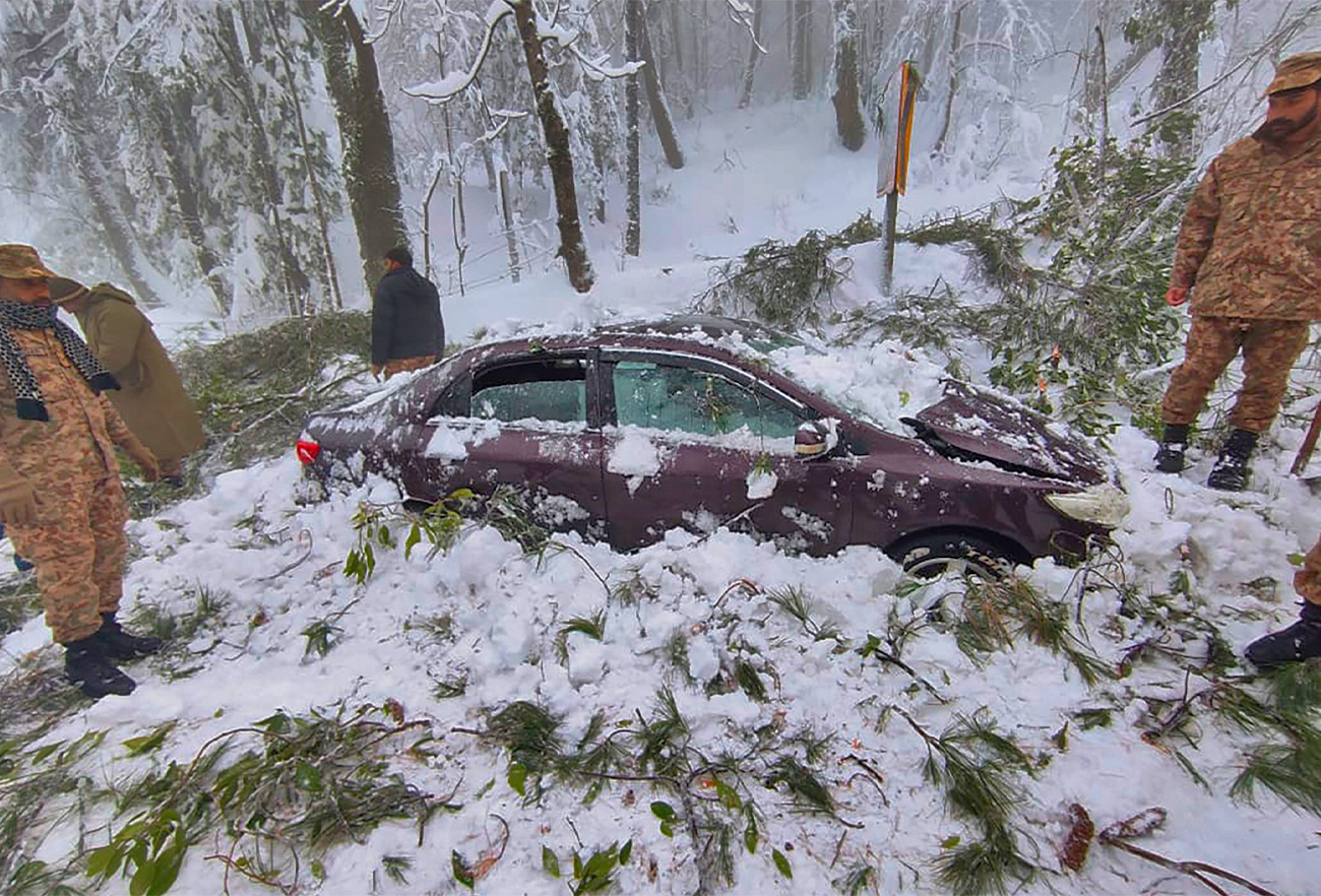 In this photo provided by ISPR, army troops take part in rescue operation in a heavy snowfall-hit area in Murree, some 28 miles north of Islamabad, Pakistan, January 8, 2022. (ISPR)