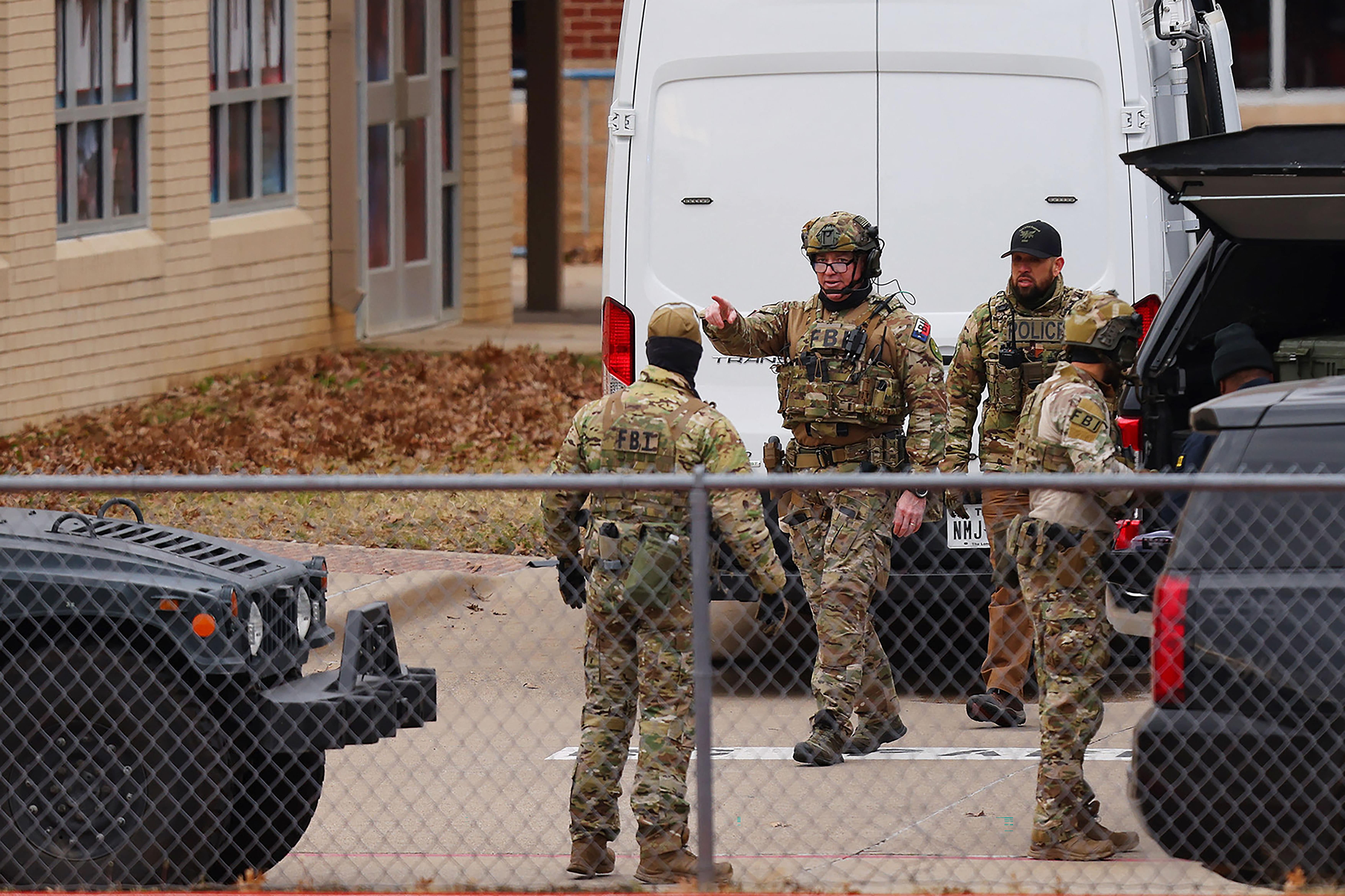 SWAT team members deploy near the Congregation Beth Israel Synagogue in Colleyville, Texas, some 25 miles (40 kilometers) west of Dallas, on January 15, 2022. (AFP)